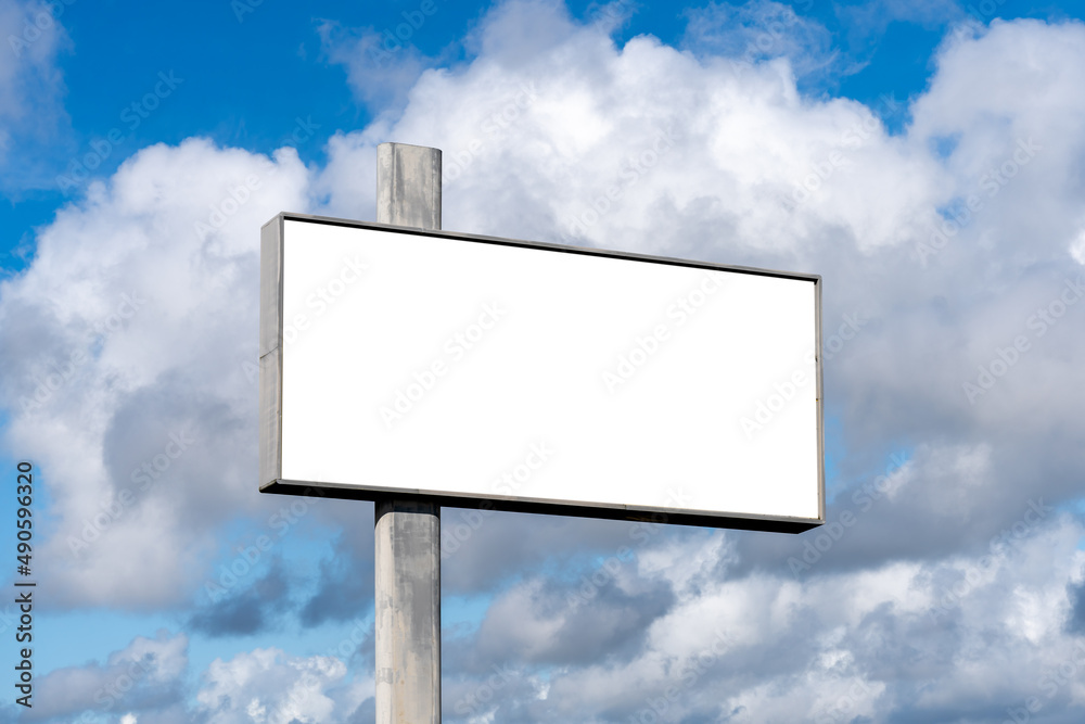 empty advertising billboard on the highway, with blue sky - advertising concept - mockup. empty advertising billboard on the highway, with blue sky - advertising concept - mockup.