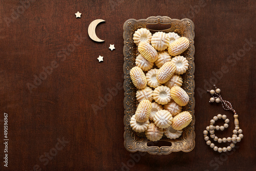 Assorted semolina maamoul or mamoul cookies with dates , walnuts and pistachio nuts. Traditional arabic Eid al Adha, Eid al Fitr sweets . Top view, copy space photo
