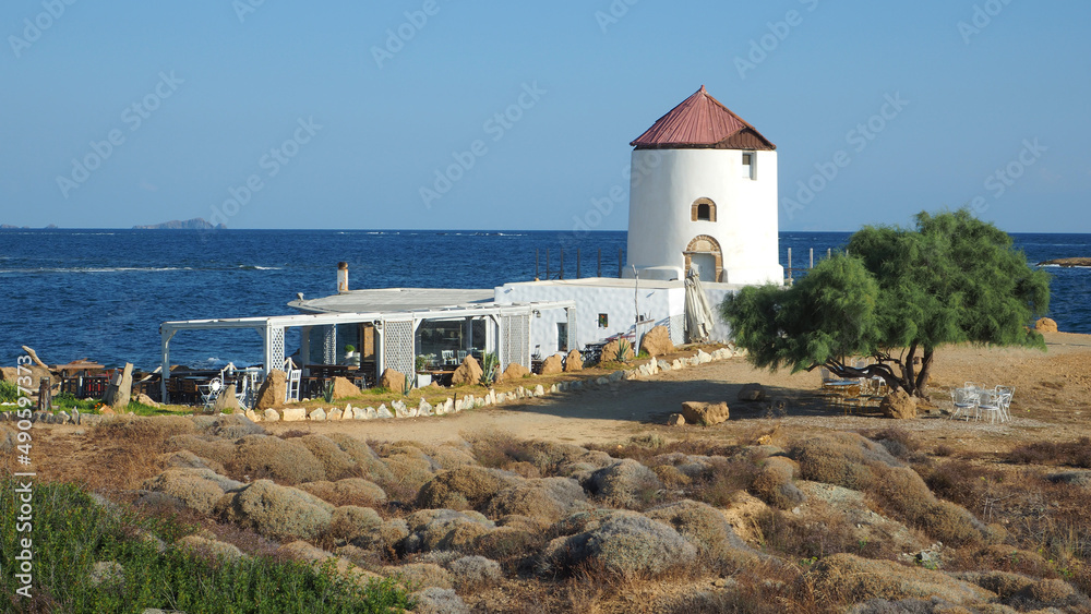Famous landmark windmill near Molos area overlooking the Aegean deep blue sea, Skiros island, Sporades, Greece