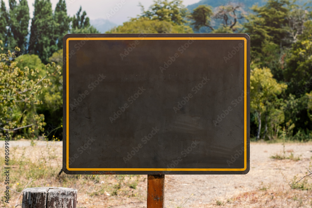Blank board sign on the forest Board sign on the woods. Metal frame in ...