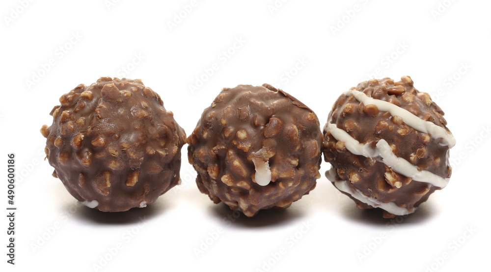 Round hazelnut chocolates isolated on white Round hazelnut chocolates isolated on white