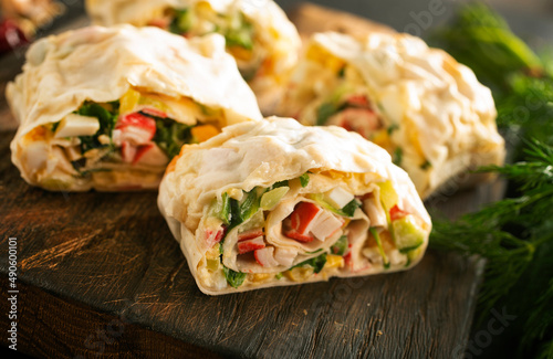 Lavash roll with crab, cheese and eggs, selective focus