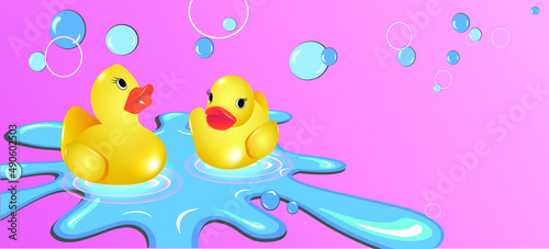 Cute rubber ducks in a puddle
