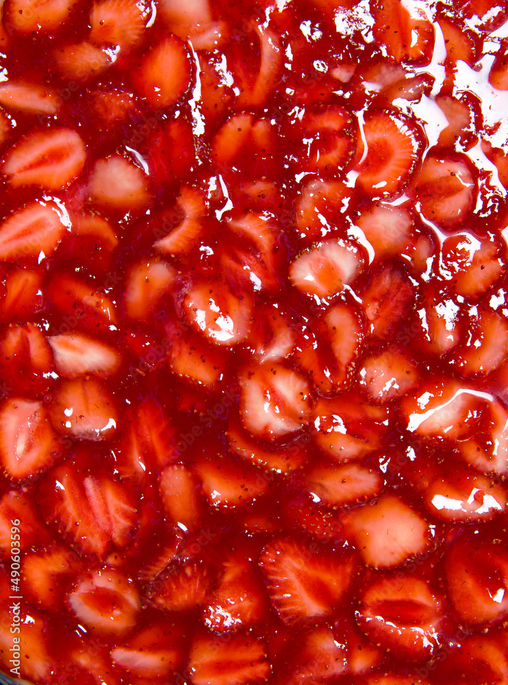 A bright colorful background of strawberries drenched in jelly, an appetizing picture, eye-catching advertising,a seductive summer background. copy space, advertising.estaurant menu.holiday for lovers A bright colorful background of strawberries drenched in jelly, an appetizing picture, eye-catching advertising,a seductive summer background. copy space, advertising.estaurant menu.holiday for lovers