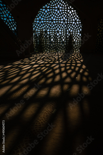 Islamic vertical background photo. Shadows of the window on ground of a mosque photo