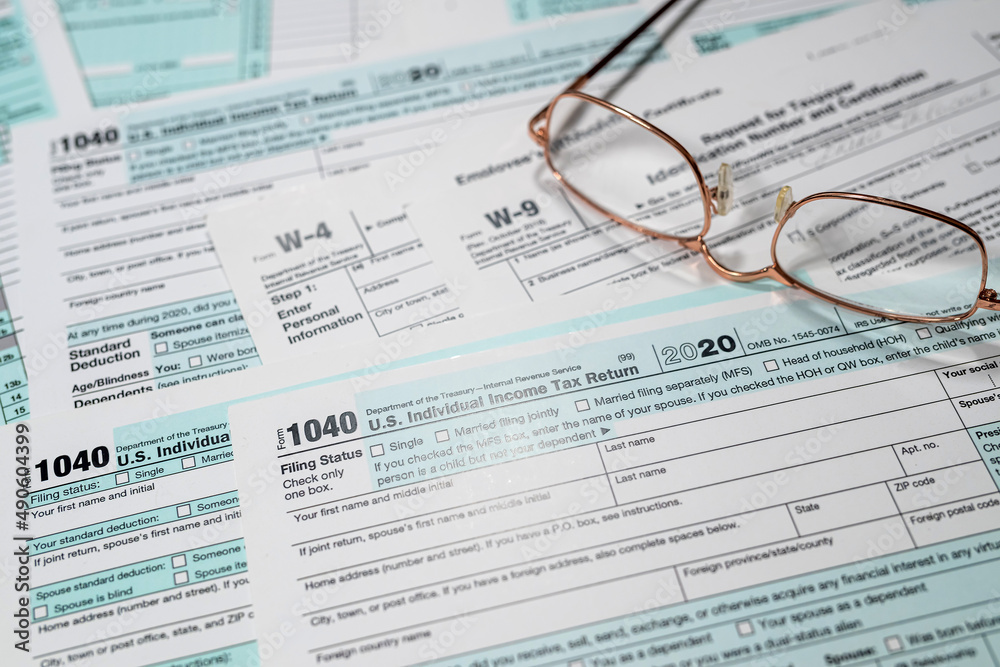 1040 US individual income tax form with glasses 1040 US individual income tax form with glasses