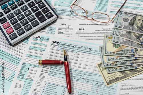 us dollar with calculator on tax form, tax time