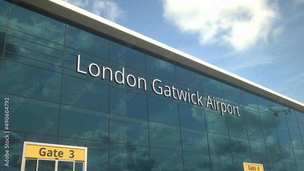 Airliner take off reflecting in the windows with London Gatwick Airport text