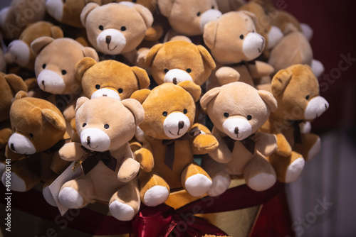 Large pile of little teddy bear dolls and toys. Cute and cuddly background. Valentine day concept.