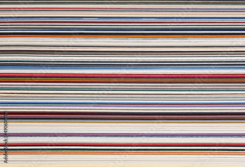 sheets of paper of various colors and thicknesses, cross section