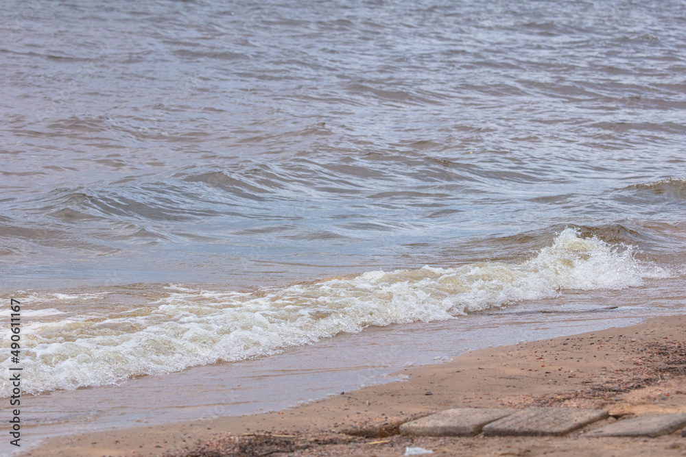 Seascape . Strong surf and wind. Rocky bottom