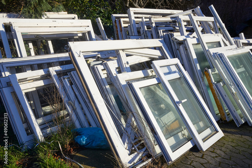 Old replaced windows are ready for removal.