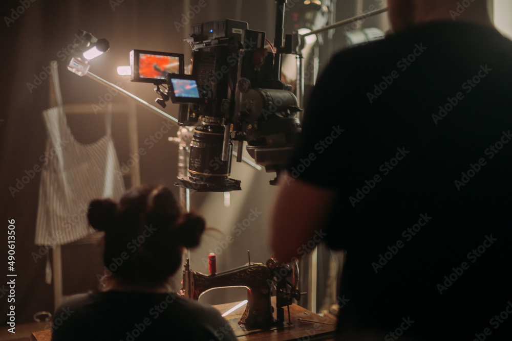 Professional cinema and video camera on the set. Shooting shift, lighting fixtures, shooting equipment and the team. Professional cinema and video camera on the set. Shooting shift, lighting fixtures, shooting equipment and the team.
