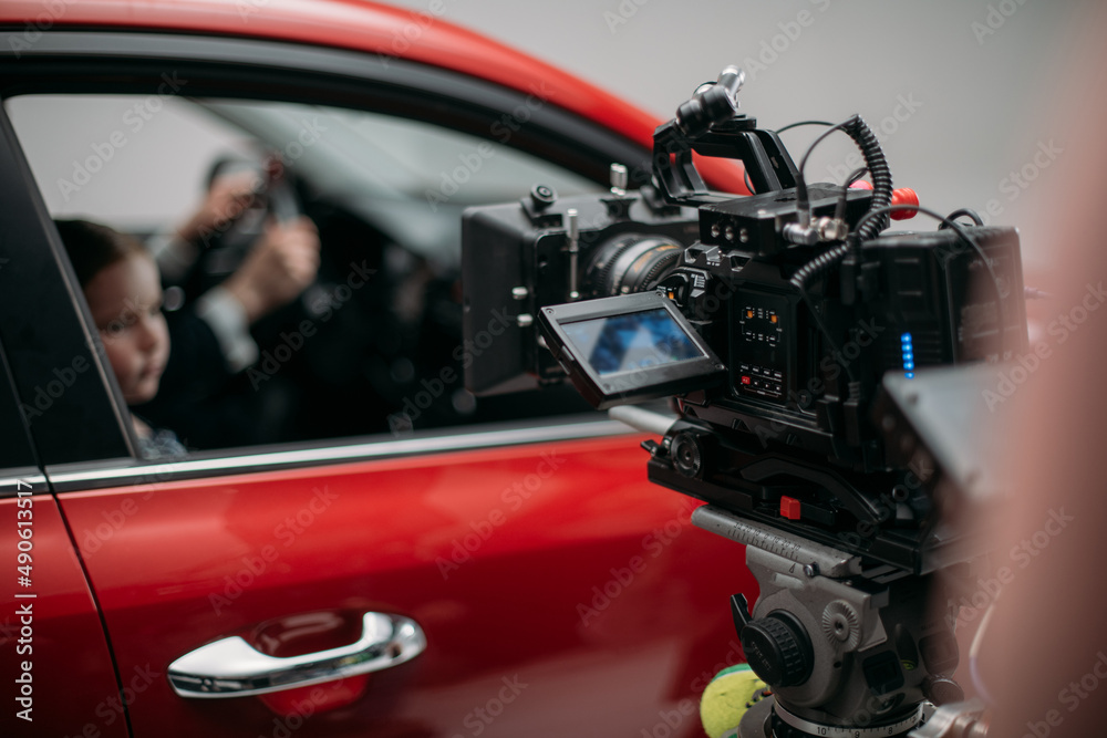 Professional cinema and video camera on the set. Shooting shift, lighting fixtures, shooting equipment and the team.