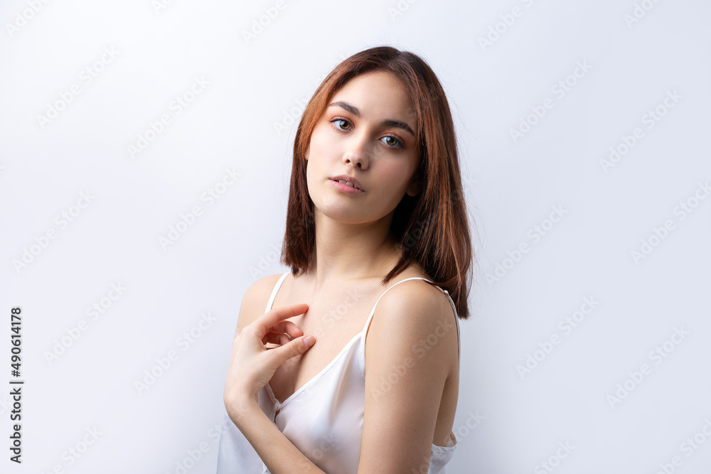 Beautiful smiling woman with clean skin, natural make-up and white teeth on a gray background Beautiful smiling woman with clean skin, natural make-up and white teeth on a gray background
