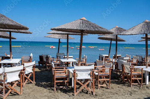 Beach unbrellas and chairs on sunny sandy beach Lady s mile in Akritori  Cyprus