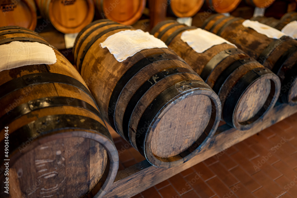 Traditional production and aging in wooden barrels of Italian Balsamic grapes vinegar dressing in Modena, Italy Traditional production and aging in wooden barrels of Italian Balsamic grapes vinegar dressing in Modena, Italy