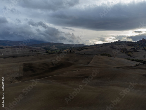 Aerial view on hills of Tuscany, Italy. Tuscan landscape with ploughed fields in autumn.