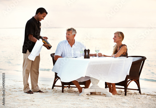 Wallpaper Mural Mature couple having dinner at the beach. Shot of a mature couple enjoying a romantic dinner on the beach. Torontodigital.ca