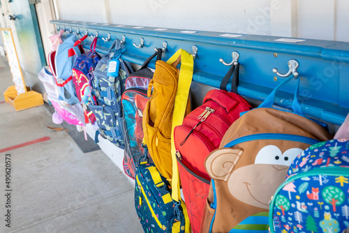 Classroom backpacks on Hooks outside of class