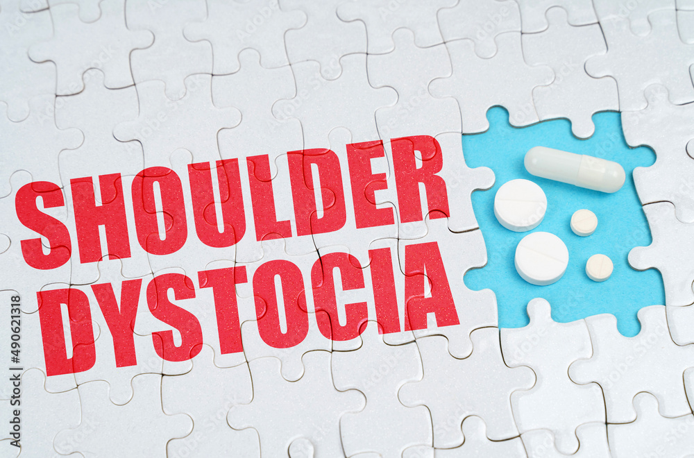 On the puzzles there is an inscription - Shoulder Dystocia, on a blue background pills. On the puzzles there is an inscription - Shoulder Dystocia, on a blue background pills.