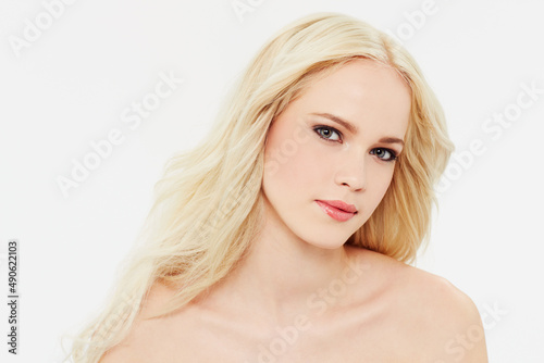 Shes got a face that could break hearts. Portrait of a beautiful blonde against a white background.
