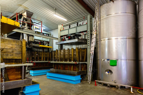 Tableau sur toile Image of hall with a automatization press for apples in factory, Asturian Sidrer