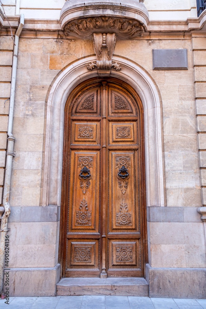 Old and beautiful ornate door in Granada, Spain