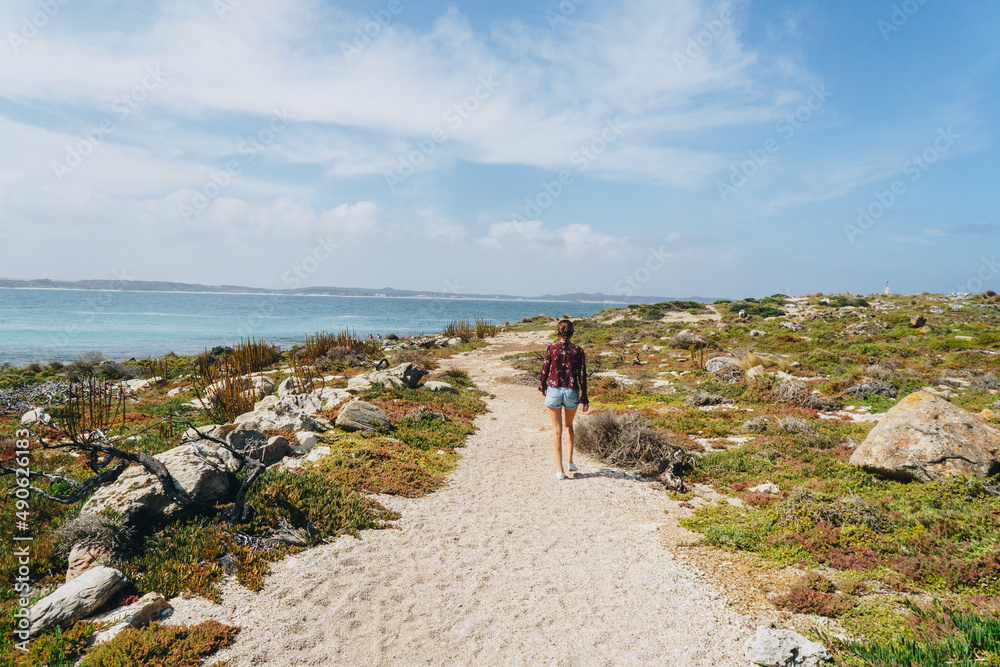 Woman walking near Vivonne Bay Jetty on kangaroo Island, South Australia