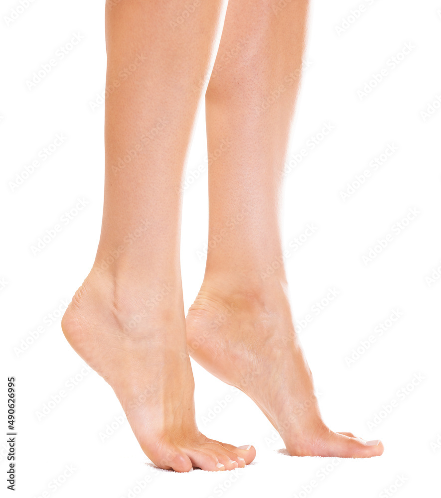 On her tiptoes. Closeup of a young womans feet standing on her tiptoes. On her tiptoes. Closeup of a young womans feet standing on her tiptoes.