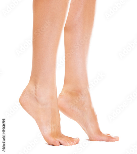 On her tiptoes. Closeup of a young womans feet standing on her tiptoes. © Tylan E/peopleimages.com