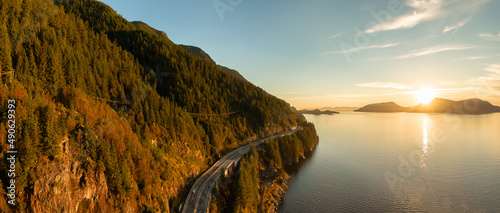 Aerial Panoramic View of Sea to Sky Highway on Pacific Ocean West Coast. Sunny Winter Colorful Sunset. Located in Howe Sound between Vancouver and Squamish, British Columbia, Canada.