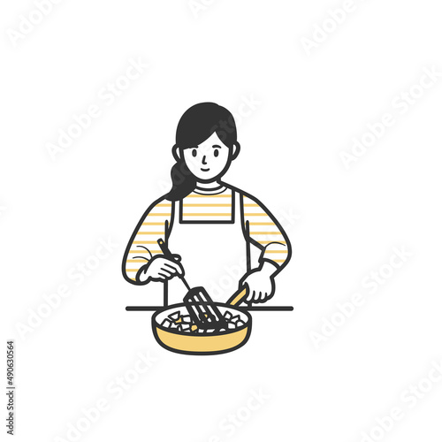 フライパンで炒め料理をする女性