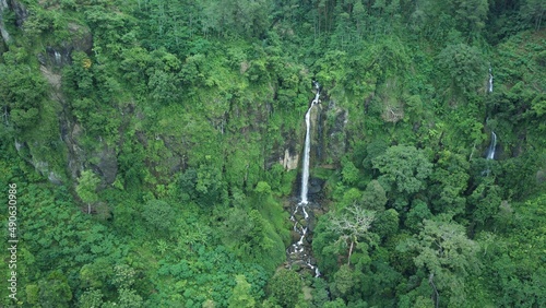 A piece of heaven in Indonesia. Stunning aerial view of hidden gem waterfall in deep forest