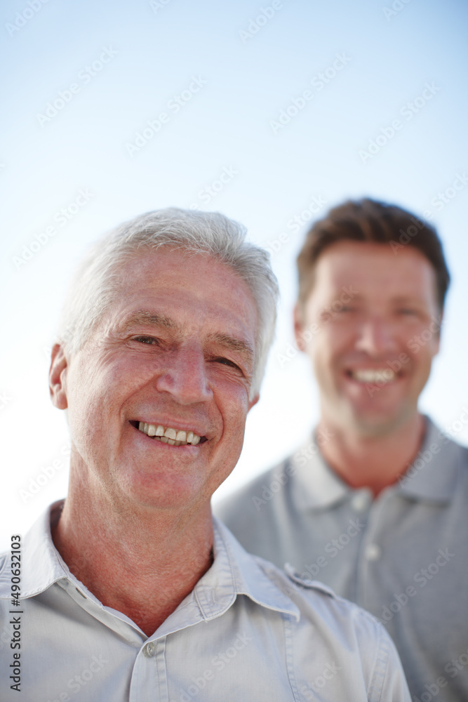 My son grew into a man. Cropped portrait of a mature man and his senior father standing outside. My son grew into a man. Cropped portrait of a mature man and his senior father standing outside.