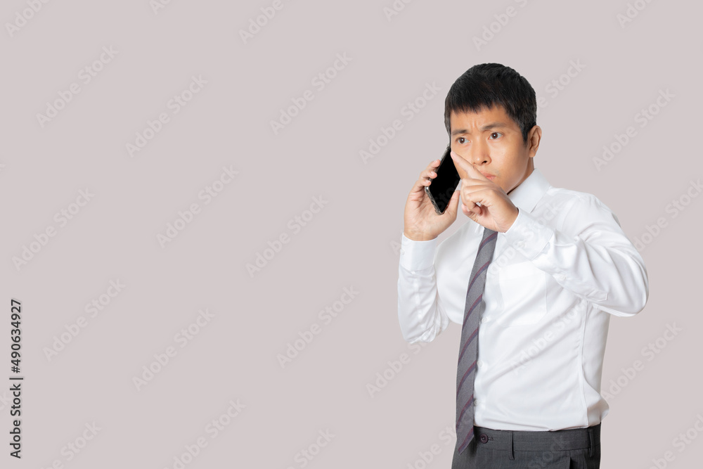 Portrait of businessman talking smartphone.