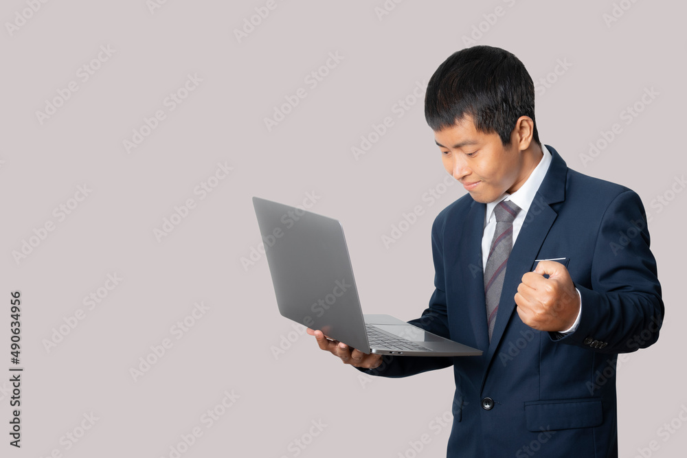 Portrait of businessman using laptop computer. Working online.