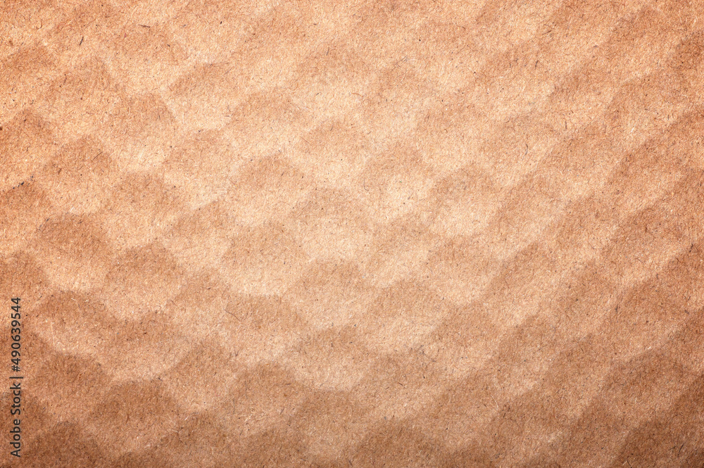 Fototapeta premium Textured background of brown recycled paper.
