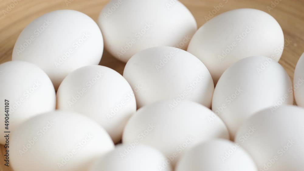 Chicken egg, rotation shot, Chicken fresh raw eggs. Healthy fresh food ingredients for breakfast. Animal products. Chicken farm fresh eggs Chicken egg, rotation shot, Chicken fresh raw eggs. Healthy fresh food ingredients for breakfast. Animal products. Chicken farm fresh eggs