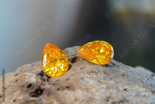 Natural Sapphire gemstone, Jewel or gems on black shine color, natural yellow gemstones on stone