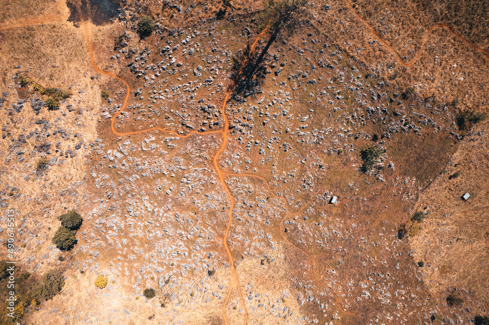 Rocks and farmland are dry during the hot summer days. Rocks and farmland are dry during the hot summer days.