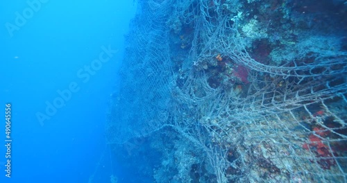 ghost hunting fish net so big underwater fisherman pollution underwater garbage environmental harming oceans driftnets photo