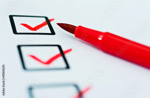 Checklist marked by a red pen