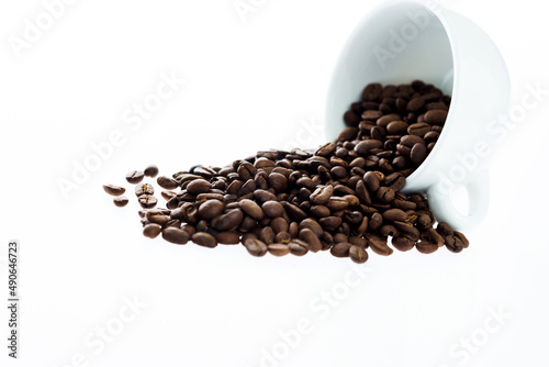 Coffee beans in cup isolated on white background