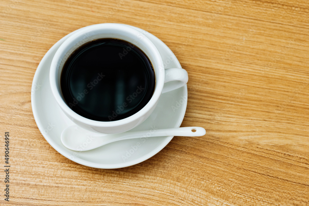 Top view of hot coffee on wooden table Top view of hot coffee on wooden table