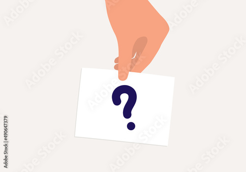 A Person’s Hand Holding A Card With Question Mark Symbol.