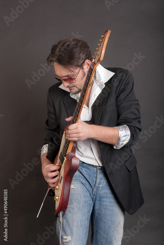 man playing electric guitar