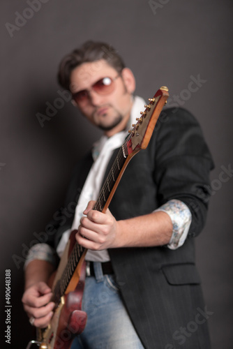man playing electric guitar