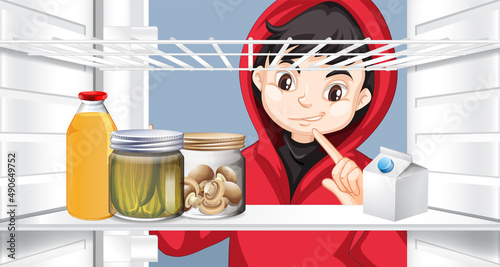 Boy looking at food in the fridge
