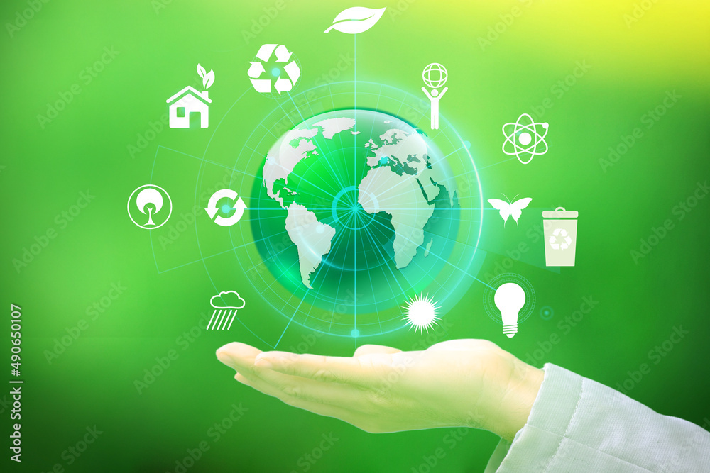 Obraz premium Earth Day is held in hands. Energy conservation, environmental preservation, and long-term development are all concepts that are being explored. Ecology concept